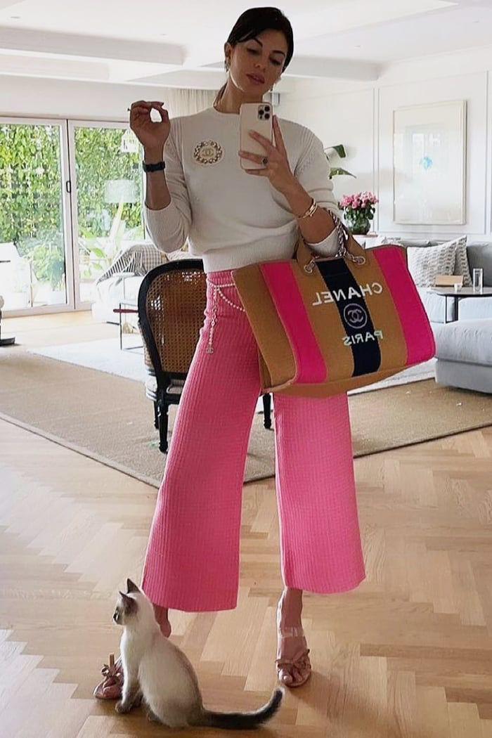 Jacqueline rocks a pink pant, adding a pop of color to her fashion game